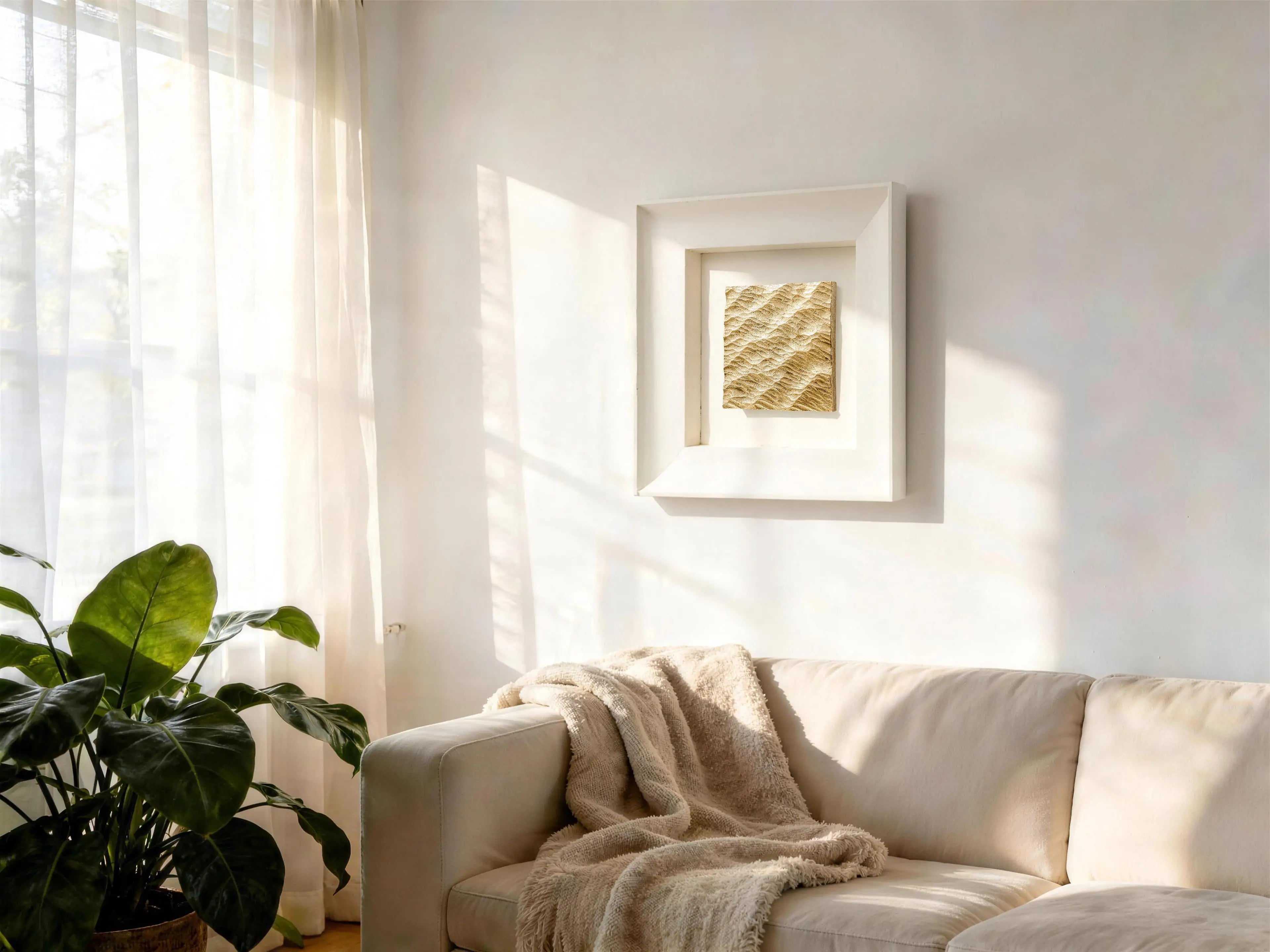 Lunar Tide — Gilded Foil · Aura Frame displayed in an interior setting, its water element energy and 3D concentric ripple texture catching light across hand-laid gilded foil crests, bringing the stillness of water captured at a single moment of disturbance to the wall.