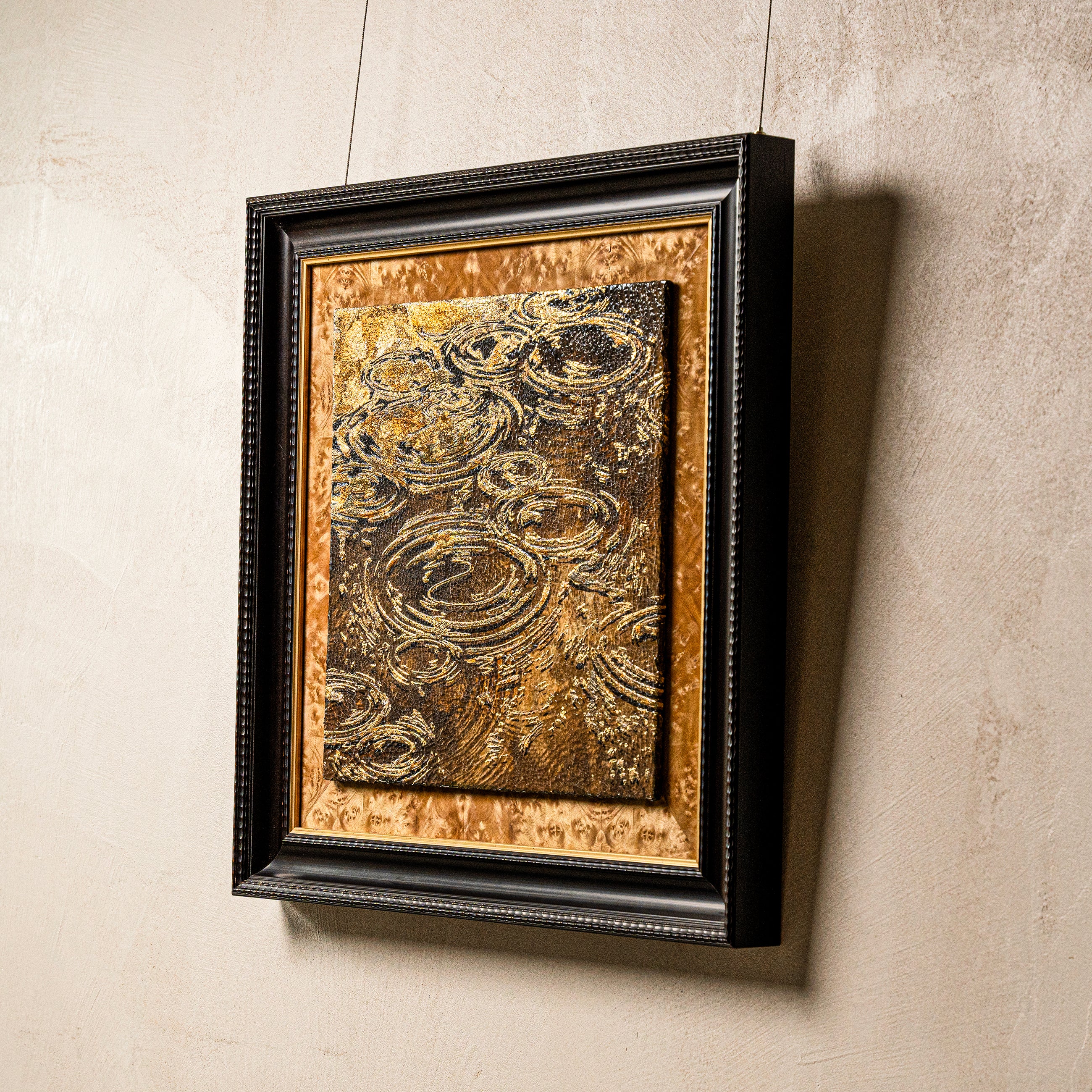 Macro detail of Harvest Tide — Patinated Foil, showcasing the visual depth of its 3D textured surface as fired foil catches light across spiraling wave ridges and a fine network of mineral crackle fissures.