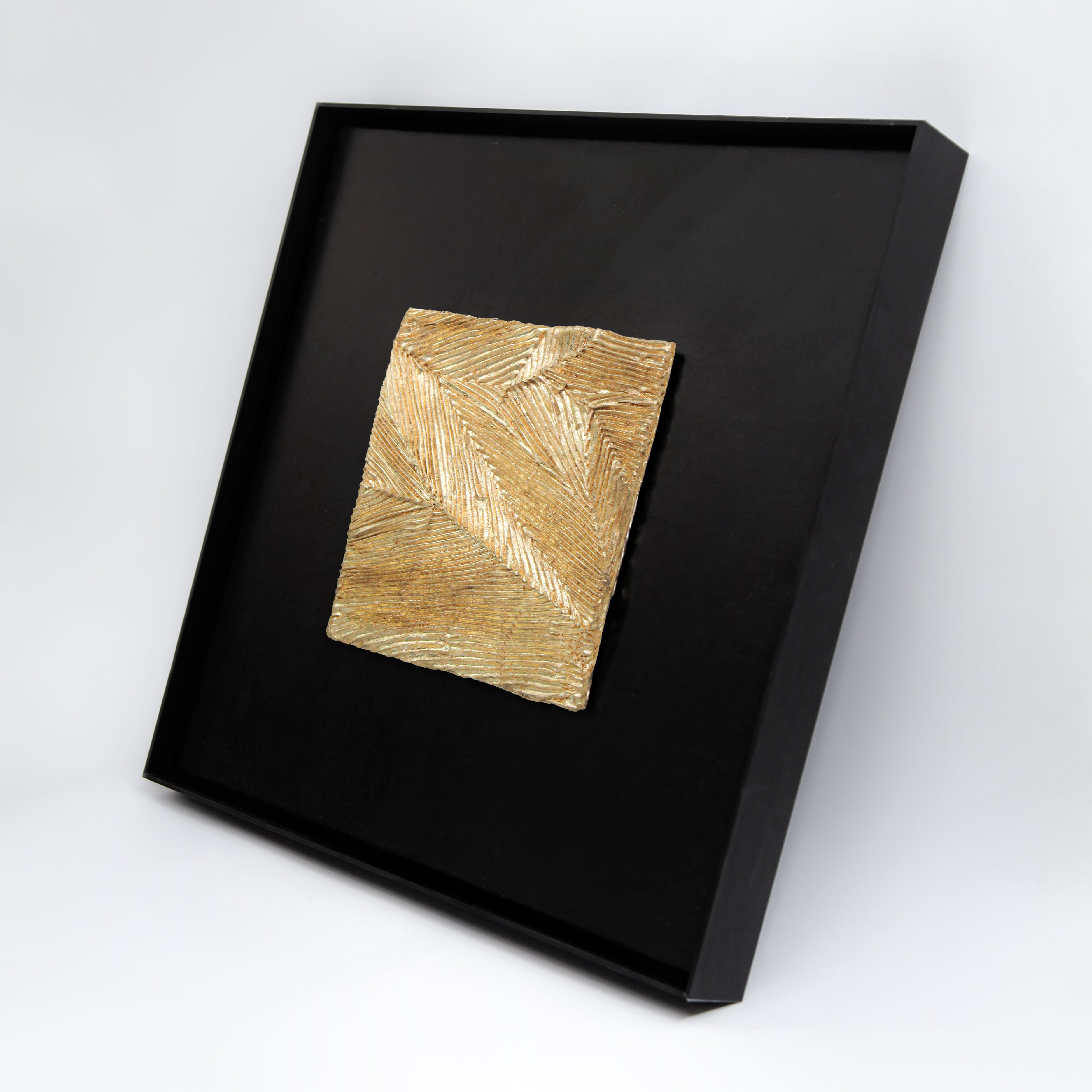 Meridian — Gilded Foil · Aura Frame, full view of a metal element wall art with hand-worked branching vein relief across the mineral ground, each channel filled with Eastern Jin Dynasty gilded foil beaten to 0.1 microns, the luster shifting with the viewing angle like a gold seam brought to the surface.
