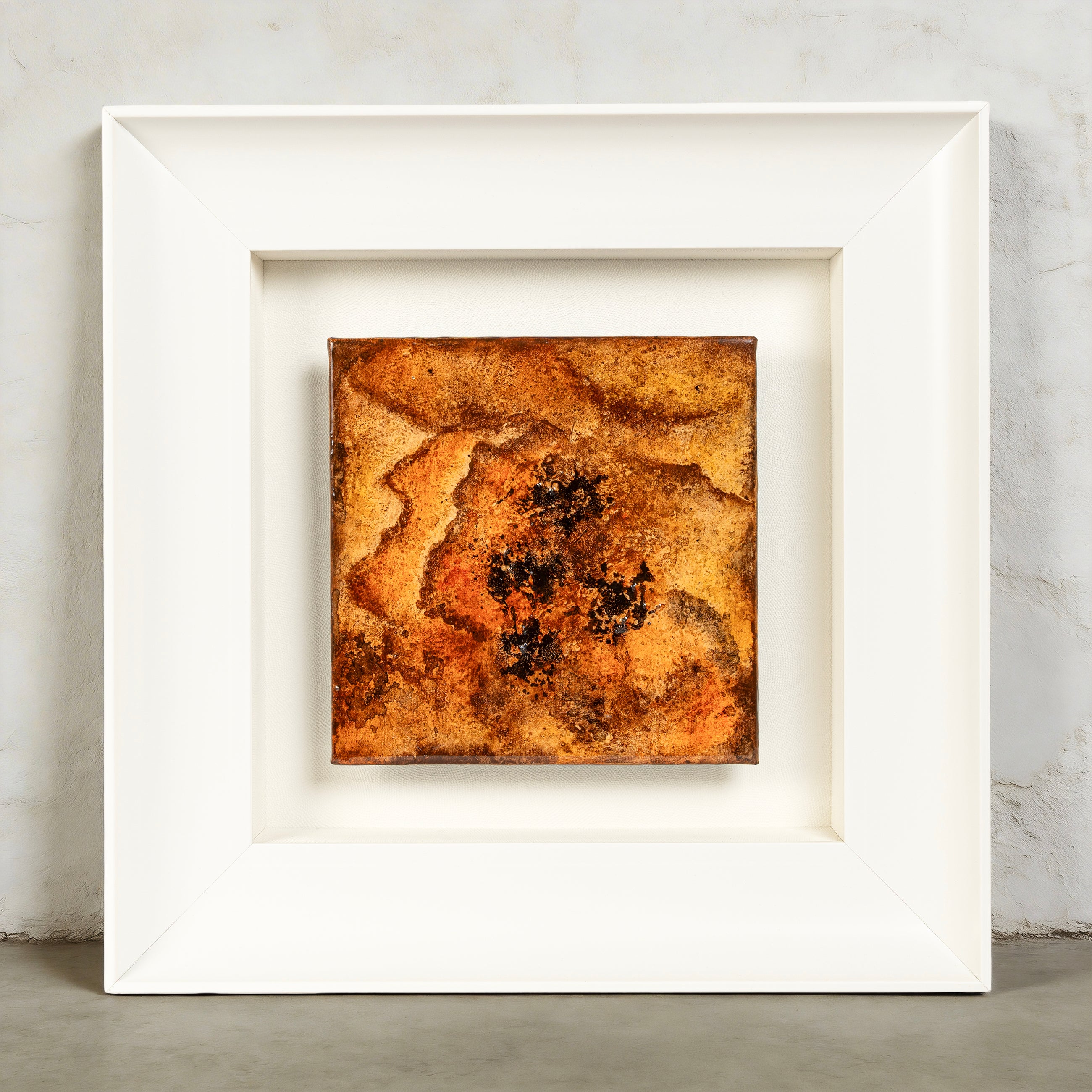 Peony — Mineral Paint · Aura Frame, full view of a fire element wall art where a three-dimensional peony form is pressed outward from the mineral ground itself, its petals built in successive dimensional passes and glazed in warm browns, oranges, and soft creams that read simultaneously as flame and flower.