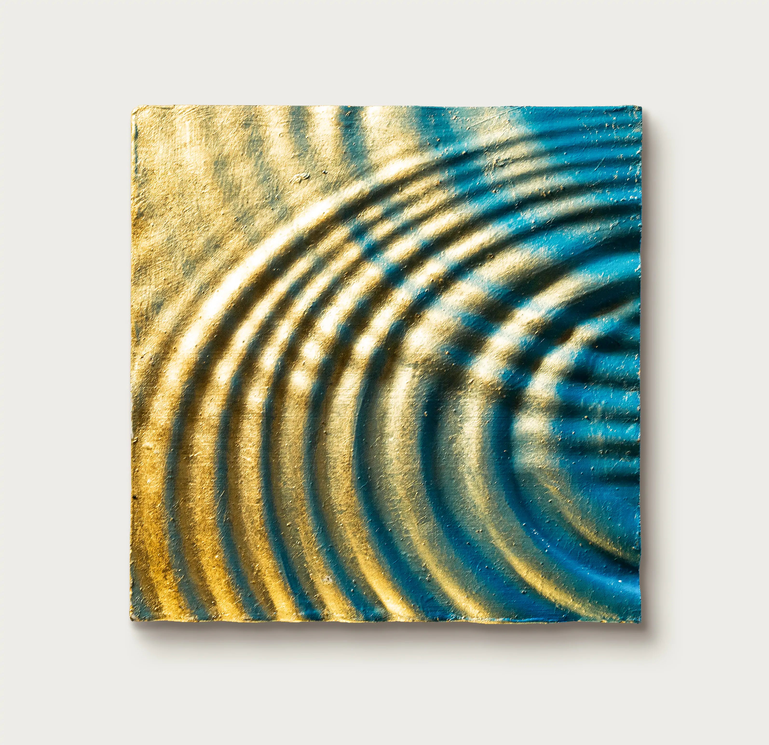 Close-up of Resonance art print canvas core revealing layered ripple patterns and fluid energy in handcrafted foil relief.