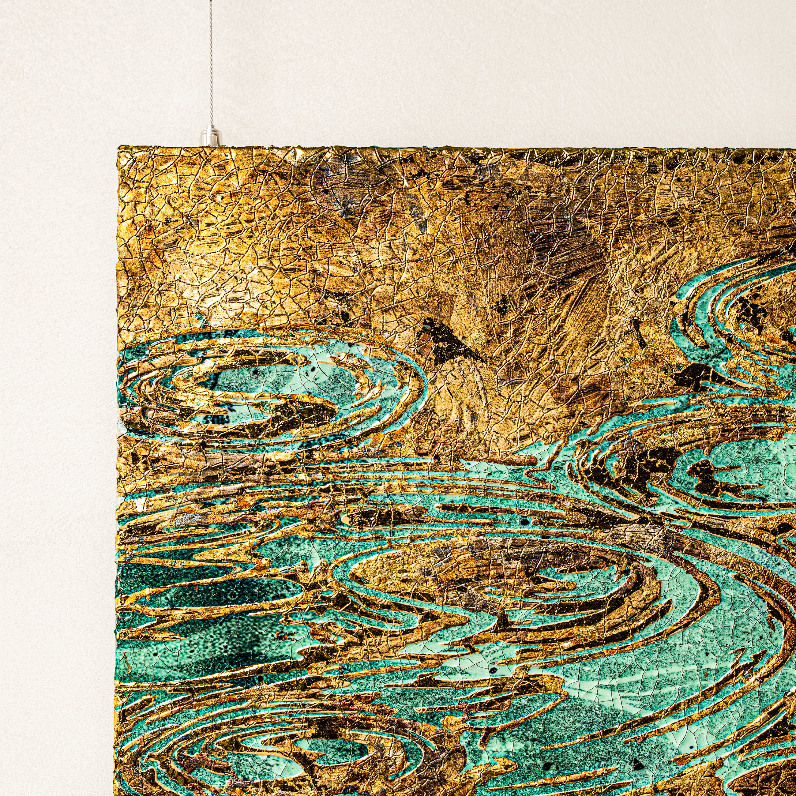Top-left quarter texture detail — layered foil surface.